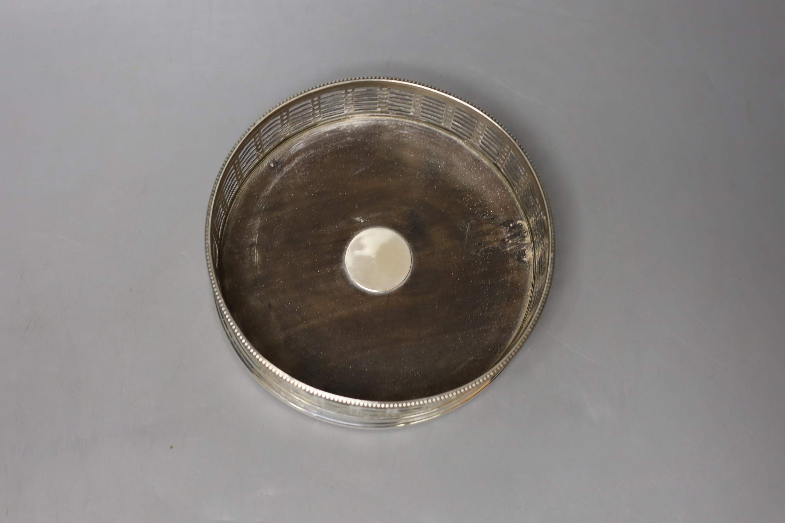 A 19th century pierced silver magnum coaster, marks rubbed, diameter 15.1cm.